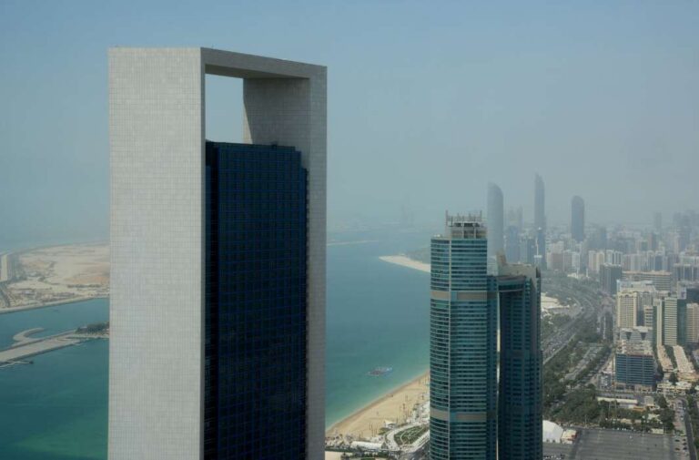 صورة عامة لأبوظبي تظهر فيها واجهة شركة أدنوك الإماراتية